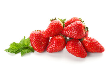 Heap of fresh strawberries with leaves on white background