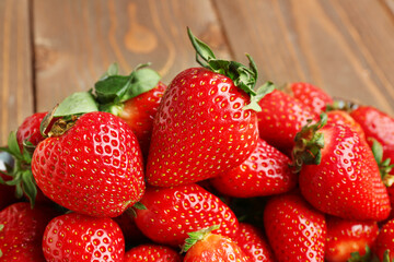 Fresh strawberries on wooden background