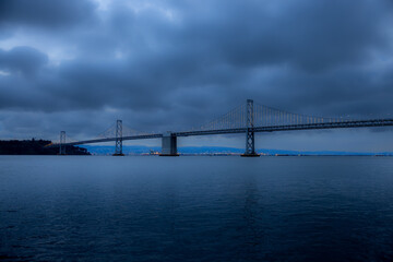 Obraz premium Photo of the Bay Bridge in San Francisco, CA Taken around 7am before a big storm.