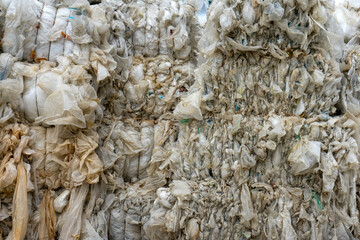 Cellophane and plastic packaging waste background. Problems of waste disposal and ecology of the...