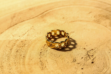 Beautiful ring on wooden background