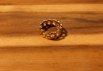 Beautiful ring on wooden background