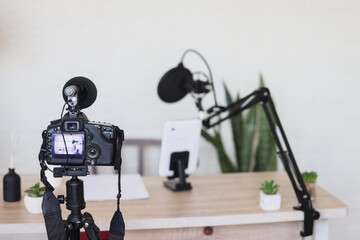 Podcast studio with microphone at creative home office. Video recording production room for content...