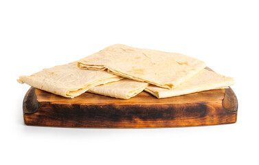 Wooden board with fresh thin lavash on white background