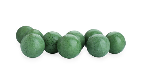 Bright green chewy gumballs isolated on white