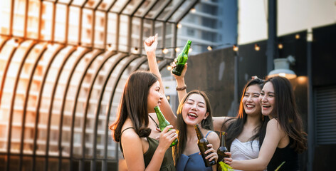 Group of young girls showing joy, celebrating, smiling faces, having fun, cheering beer, festival celebration concept.