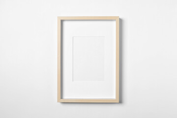 Empty wooden frame on white background. Mockup for design