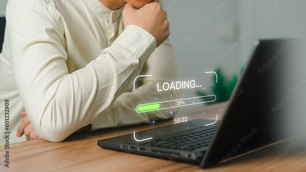 Poster Businessman using a laptop computer for download and update software and waiting to loading digital file data form website, very slow internet form wifi. Concept of waiting for load of loading symbol.