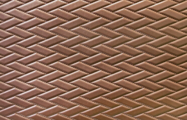 brown leather background and texture as a pattern for the interior car or a sofa or wall covering