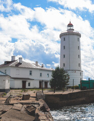 Fototapeta na wymiar Tolbukhin island lighthouse, Saint-Petersburg, Kronstadt, Gulf of Finland view, Russia in a summer sunny day, lighthouses of Russia travel