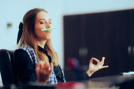 Office Woman Balancing a Pen Under her Nose in Breathing Exercise. Businesswoman trying to relax in need to unwind from work
