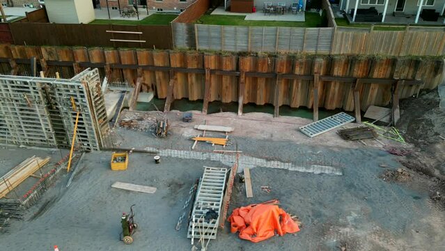 Temporary retaining wall support for deep construction pit foundation, aerial