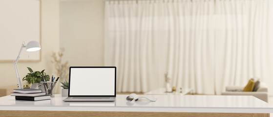 Home workspace with laptop mockup on a white tabletop in beautiful white living room.