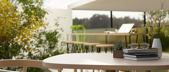 Copy space on a minimal wooden tabletop in minimal cozy co-working space.