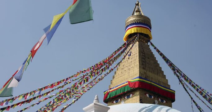 View of The Great Stupa Boudhanath in slow motion with flags moving, Kathmandu.