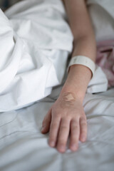 Child hand with bandage
