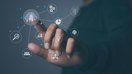 Businessman using laptop with cloud computing technology internet storage network.