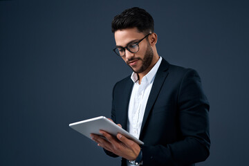 Technology, professional young businessman with tablet and in a studio background. Social...