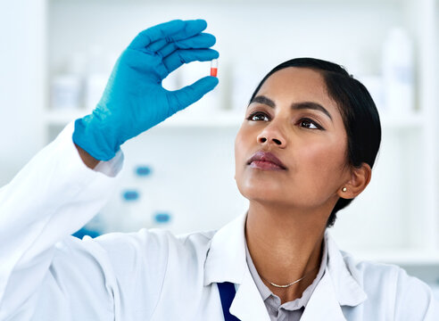 Woman, pills and medical science research or scientist development for future drugs, medicine or product. Face of female worker in laboratory for pharmaceutical discovery, innovation and analysis