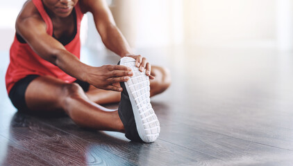 Fototapeta na wymiar Fitness, African woman stretching for healthy exercise and in studio or gym. Athlete hands training or workout on mockup space, shoe closeup and female person stretch legs for body goals or wellness