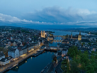Aerial view over Swiss City of Zürich with Limmat River, old town and Lake Zurich on a beautiful spring evening with colorful dramatic sky. Photo taken May 6th, 2023, Zurich, Switzerland.