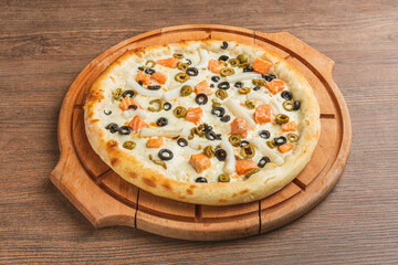 Fresh classic pizza with tomato sauce, mozzarella, spicy chorizo, bell pepper on a wooden background