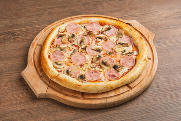 Fresh classic pizza with tomato sauce, mozzarella, spicy chorizo, bell pepper on a wooden background