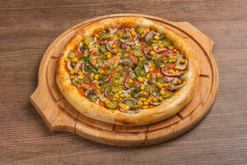 Fresh classic pizza with tomato sauce, mozzarella, spicy chorizo, bell pepper on a wooden background