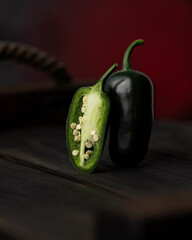 Jalapeno black pepper. Hot mexican pepper and half pepper cutaway view. Pepper seeds. Peppers stand...