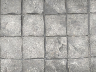 The gray cement floor creates a square pattern for the outdoor floor, used as a background. or for interior and exterior decoration