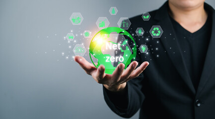 Net Zero Emission Reduction Concept planting trees Help eliminate gas reduce global warming, male hand holding earth showing carbon reduction icon, protect environment, renewable resources