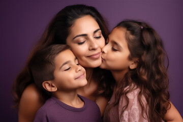 Latinx mid woman and children kissing and hugging on a violet background