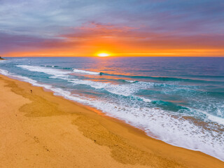 Fototapeta na wymiar Aerial sunrise at the seaside with cloud cover