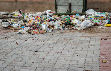 garbage waste items and plastic begs liter in open at day from different angle