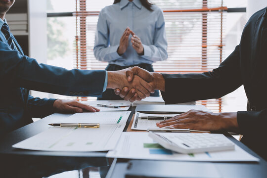 Business partners successful handshake Congratulations business teamwork winning success deal in modern office partnership approval.