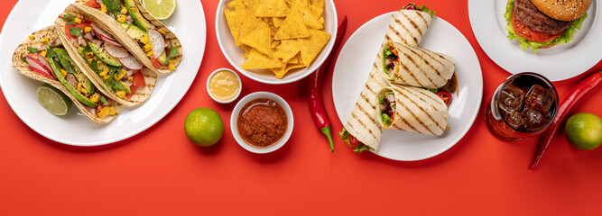 Fototapeta na wymiar Mexican food featuring tacos, burritos, nachos, burgers