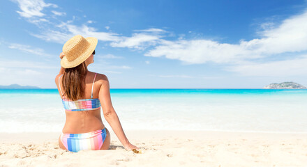 Woman in bikini on the tropical sea beach