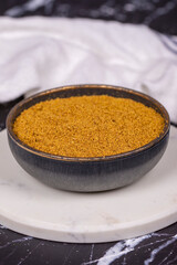 Cumin powder on dark background. spice or seasoning concept. Ground or sifted garam masala. indian spice. Close up