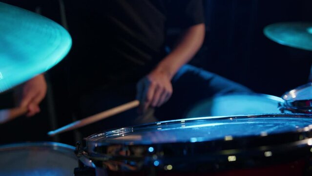 A man plays drums during a sound check before a concert
