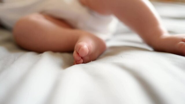 Close-up of baby feet and toes, cute baby sleeping peacefully in his crib at home.Independent sleep,childhood protection
