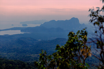 The background of the sea by the evening sea, with natural beauty (sea water, rocks, sky) and fishermen are fishing by the river bank, is a pleasure during travel.