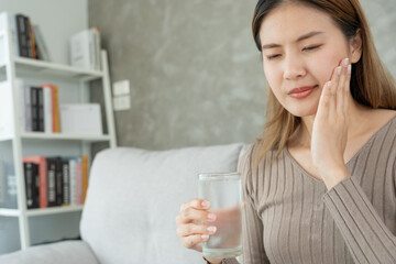 Asian woman feel sensitive teeth after drinking cold, female suffer tooth, decay problems, dental...