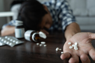 asian man use pills overdose, stressed, sad, drug abuser, drug addict, sick, unhealthy, unhappy, suicide, depressed or hopeless, Anti drug, drug addict, life and family problems, unmotivated