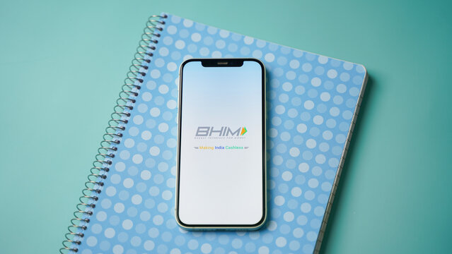 BHIM UPI mobile phone app on colour background: Kolkata, West Bengal, India - December 15 2022