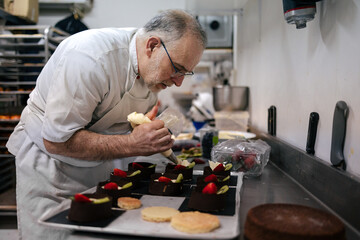 Pastry chef using a pastry bag