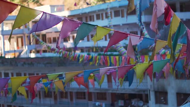 Closeup of Prayer flags on the top of the Gurudwara Sahib Manikaran at Manikaran near Kasol in Himachal Pradesh, India. Prayer flags above the gurudwara. Gurudwara in the Parvati valley.