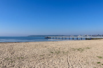 view of the beach and pier in the sea