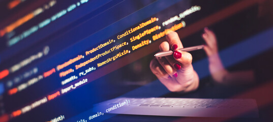 programmer at home writes programming code script on virtual screen