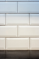 white ceramic textured rectangle glazy tile background with black floor  © jan_S