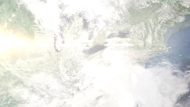 Earth zoom in from outer space to city. Zooming on Euclid, Ohio, USA. The animation continues by zoom out through clouds and atmosphere into space. Images from NASA